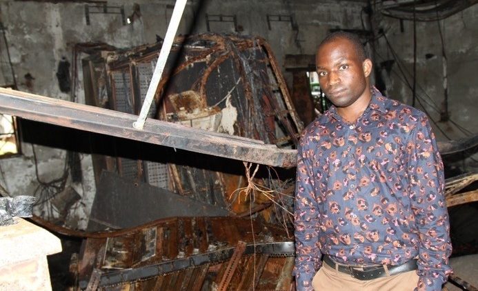 Fr. Jailos Mpina of Luntha TV at the scene of a fire that damaged Malawi Telecommunications Limited’s broadband hub in Lilongwe 