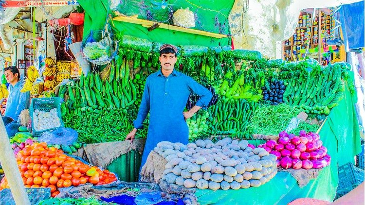 Akhuwat has helped this young man to set up a shop. 
