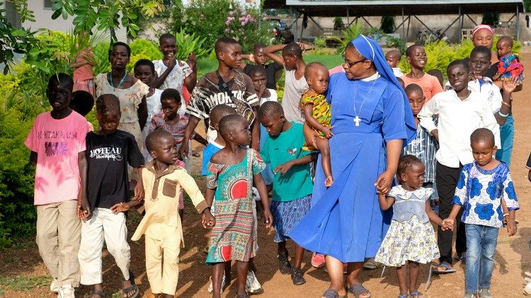 Sr. Stan Mumuni with some of the children from the orphanage