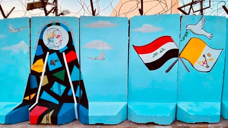 A painting on a wall indicating preparations for the Pope's visit to Iraq