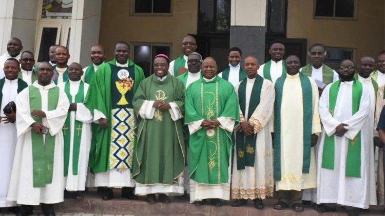 Nigerian social communications with Bishop Isizoh (with skullcap)