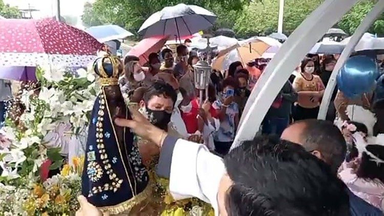 A statue of Our Lady of Aparecida during a celebration
