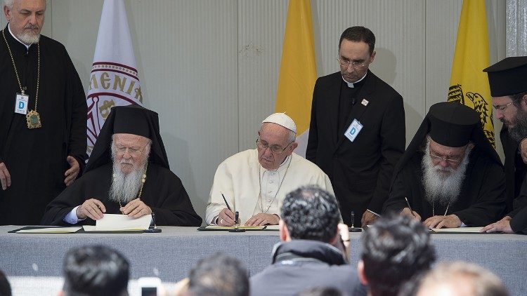 Pope Francis signing Joint Declaration in Lesbos with Greek Orthodox Primate Ieronymos and Patriarch Bartholomew of Constantinople in 2016