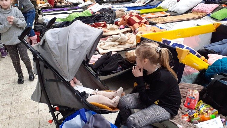 Refugees in Korczowa, Poland, visited by Cardinal Konrad Krajewski during his mission there