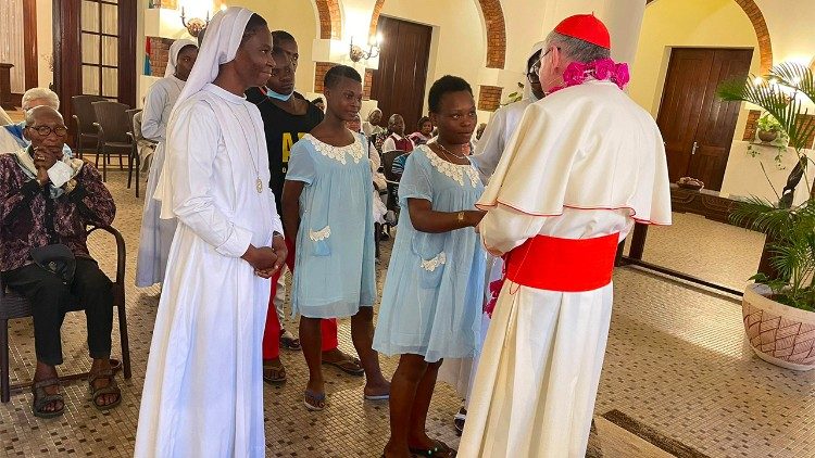 Cardinal Parolin greets two girls