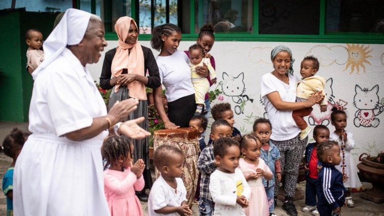 Abebech Tesfaje, an internal migrant from Zwai (standing in centre with white T-shirt) at Mary Help College where she studied sewing and fashion design. Photo Copyright: Giovanni Culmone/GSF