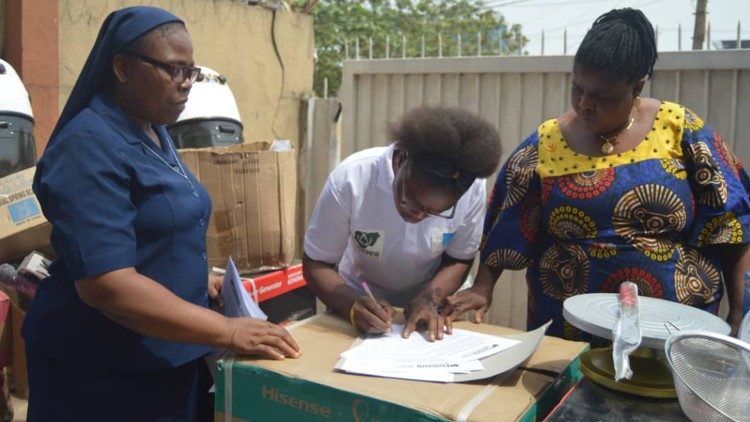 COSUDOW staff with electronic equipment that the centre gives to women who choose to start a hair salon. 