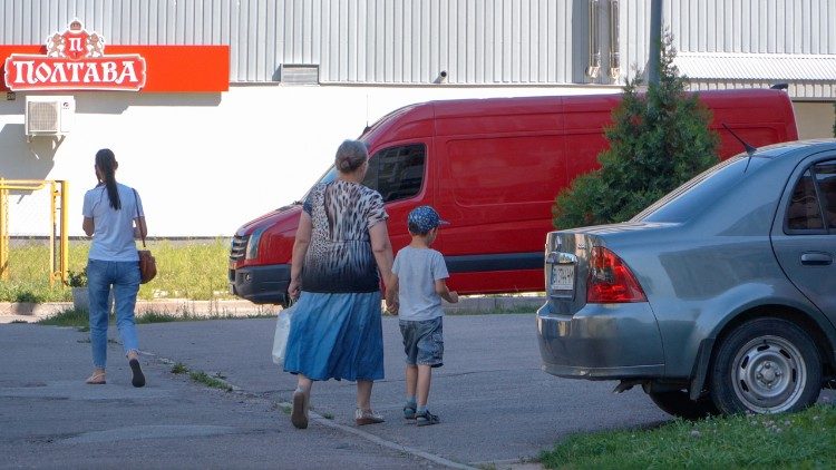 A parent and child on their way to Ohmatdyt