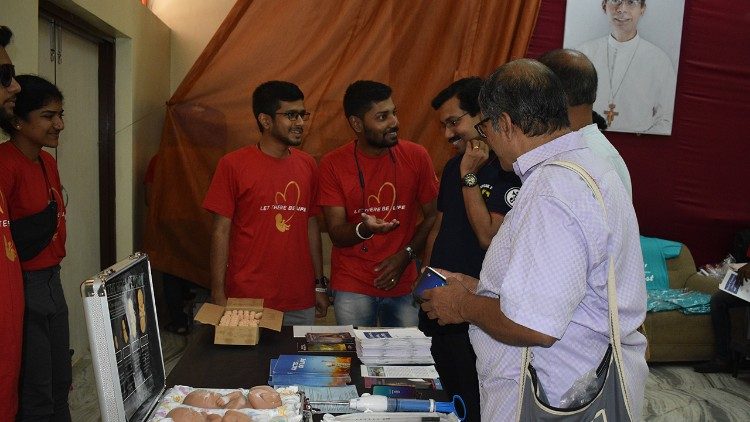 Volunteers explaining at the exhibition