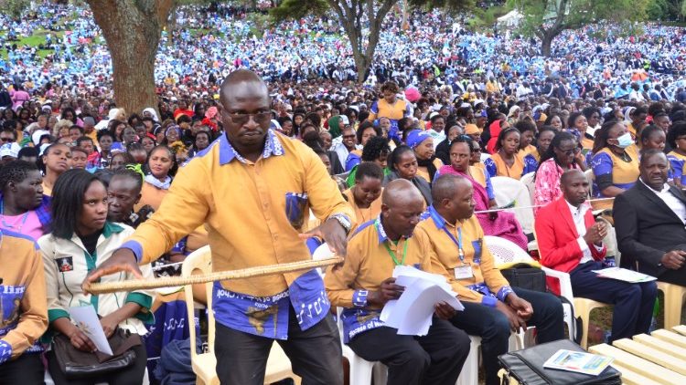Choir member plays traditional instrument at Kenya's National Prayer Day.