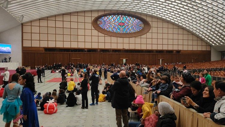 Families gather in the Paul VI Hall to greet the Pope